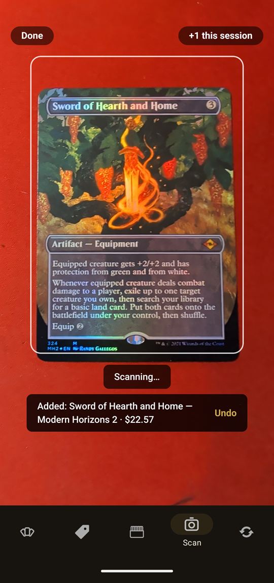 Manahaul scanner mid-scan: a foil Sword of Hearth and Home recognized by the camera and added to the collection with an undo button